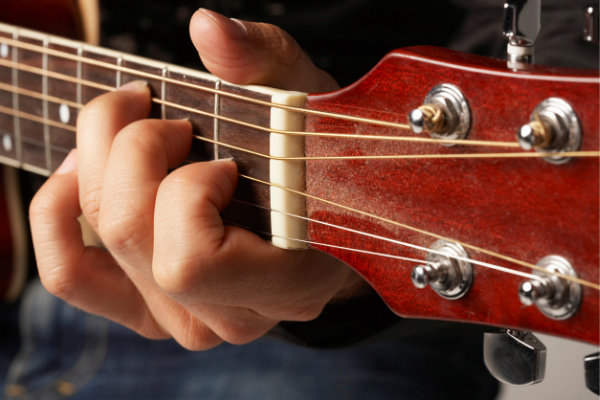 music-guitar-being-played-closeup