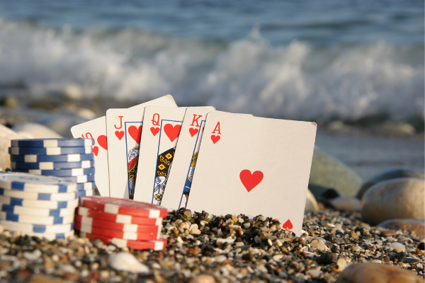 cards-and-chips-in-sand-3