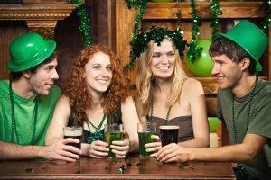 st_patricks_group_in_bar_wearing_st_patricks_day_hats_141719401-2 st_patricks_group_in_bar_wearing_st_patricks_day_hats_141719401-2